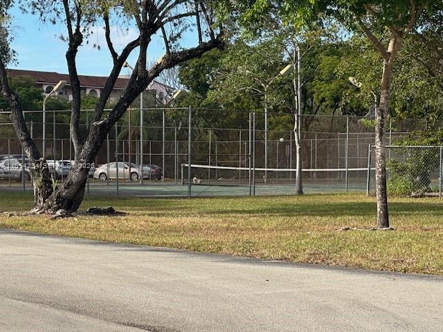 3905 North Nob Hill Road, Unit 304 Sunrise, FL 33351 - Photo 15 of 17 a view of a yard with large trees