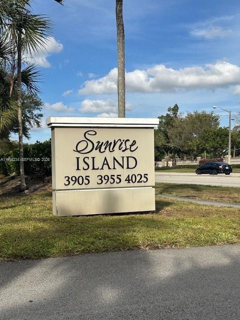 3905 North Nob Hill Road, Unit 304 Sunrise, FL 33351 - Photo 17 of 17 a sign broad on the side of a road