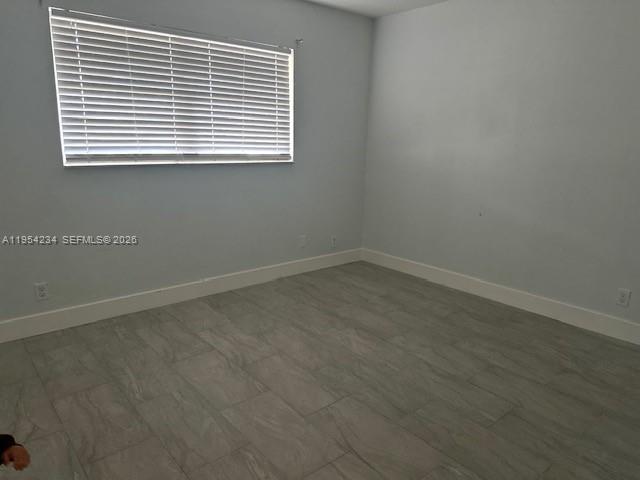 3905 North Nob Hill Road, Unit 304 Sunrise, FL 33351 - Photo 8 of 17 an empty room with a window
