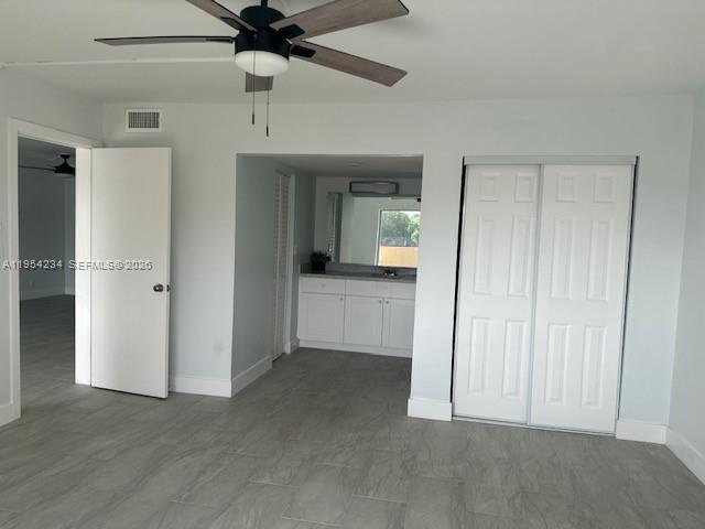 3905 North Nob Hill Road, Unit 304 Sunrise, FL 33351 - Photo 9 of 17 an empty room with fan and entrance