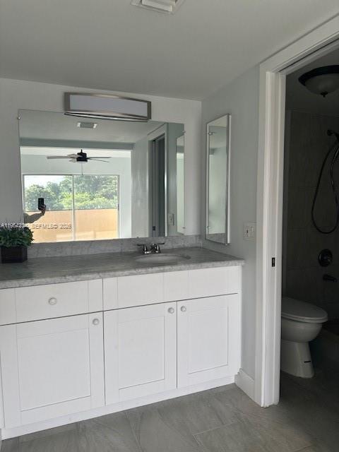 3905 North Nob Hill Road, Unit 304 Sunrise, FL 33351 - Photo 10 of 17 a bathroom with a sink a toilet and a mirror