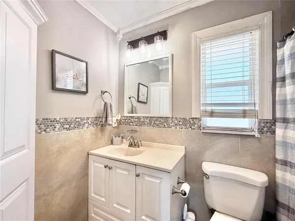 a bathroom with 2 sink and a mirror