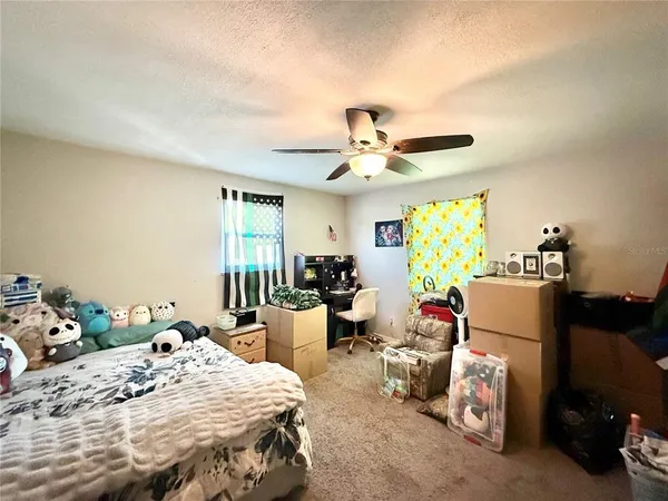 a bed room with a bed and a table