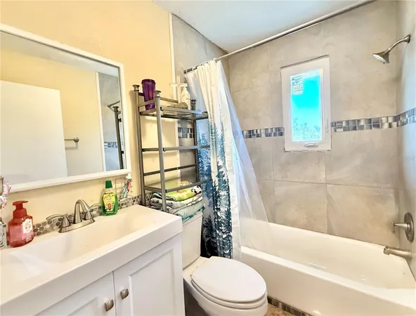 a bathroom with a sink a toilet and a bathtub