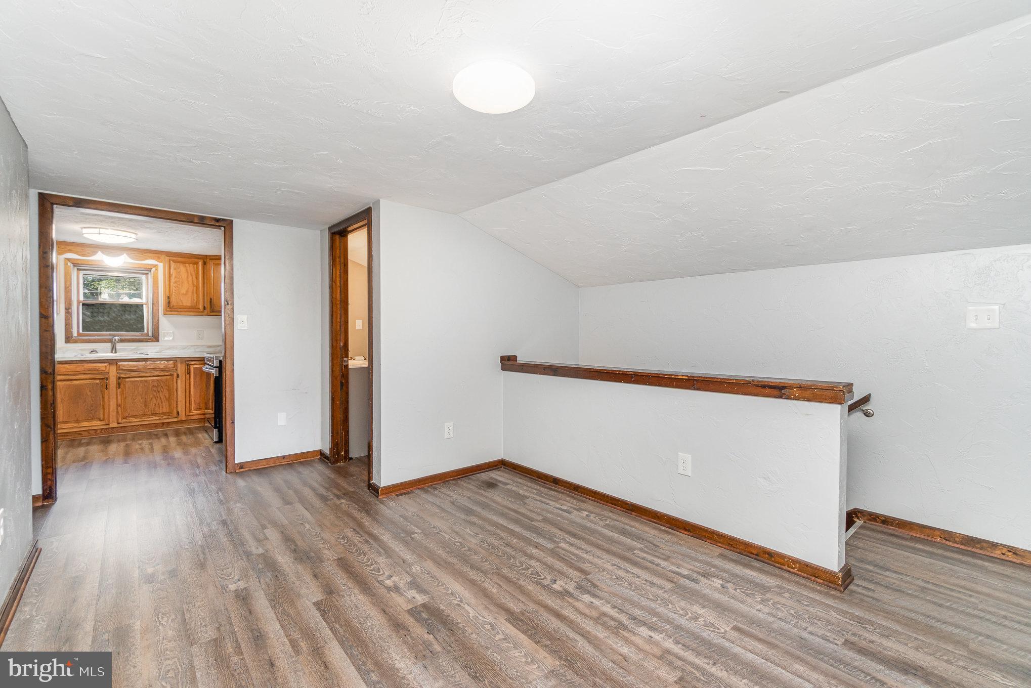 31 East Water Street Gettysburg, PA 17325 - Photo 7 of 26 wooden floor in an empty room