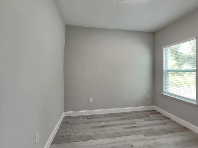 a view of an empty room and window
