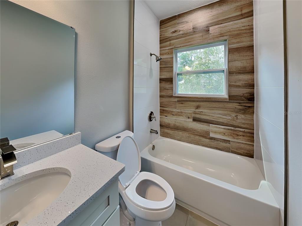 11604 North Kenlake Circle Citrus Springs, FL 34434 - Photo 14 of 15 a bathroom with a sink a toilet and a bathtub