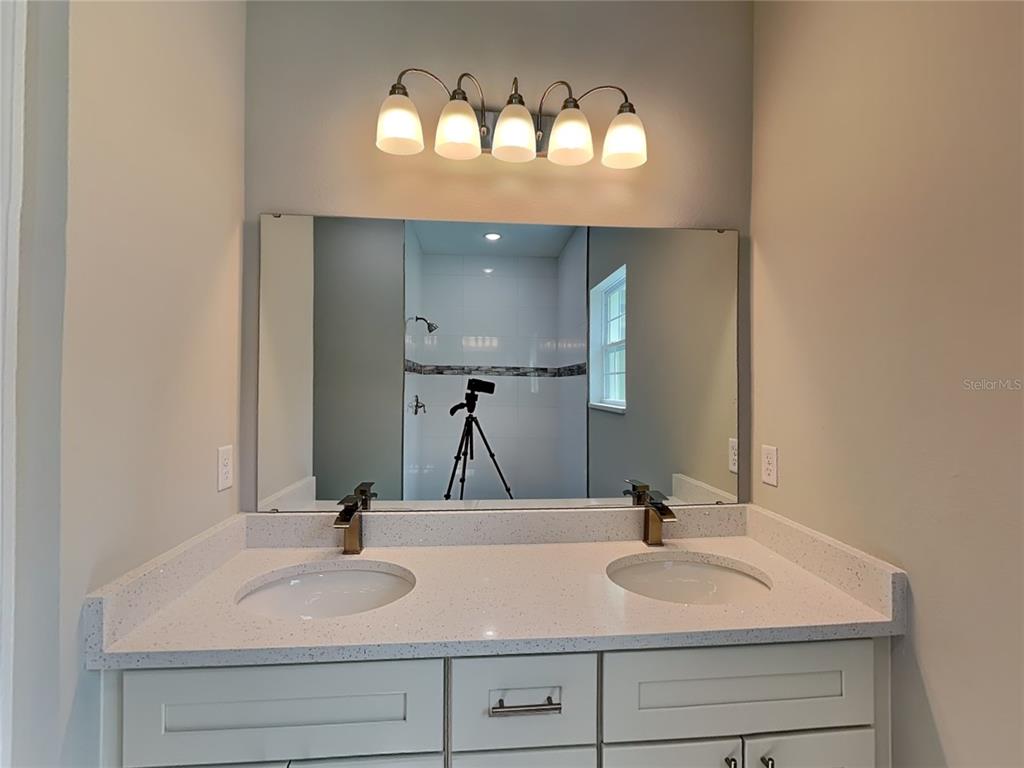 11604 North Kenlake Circle Citrus Springs, FL 34434 - Photo 7 of 15 a bathroom with double vanity sinks and a mirror