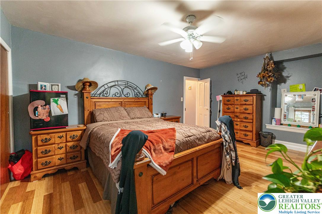 2485 Hieter Road Quakertown, PA 18951 - Photo 42 of 97 Hardwood floors and a ceiling fan create a comfortable atmosphere in this well-appointed sleeping space.