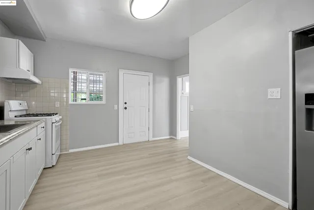 a view of entryway with wooden floor and stairs