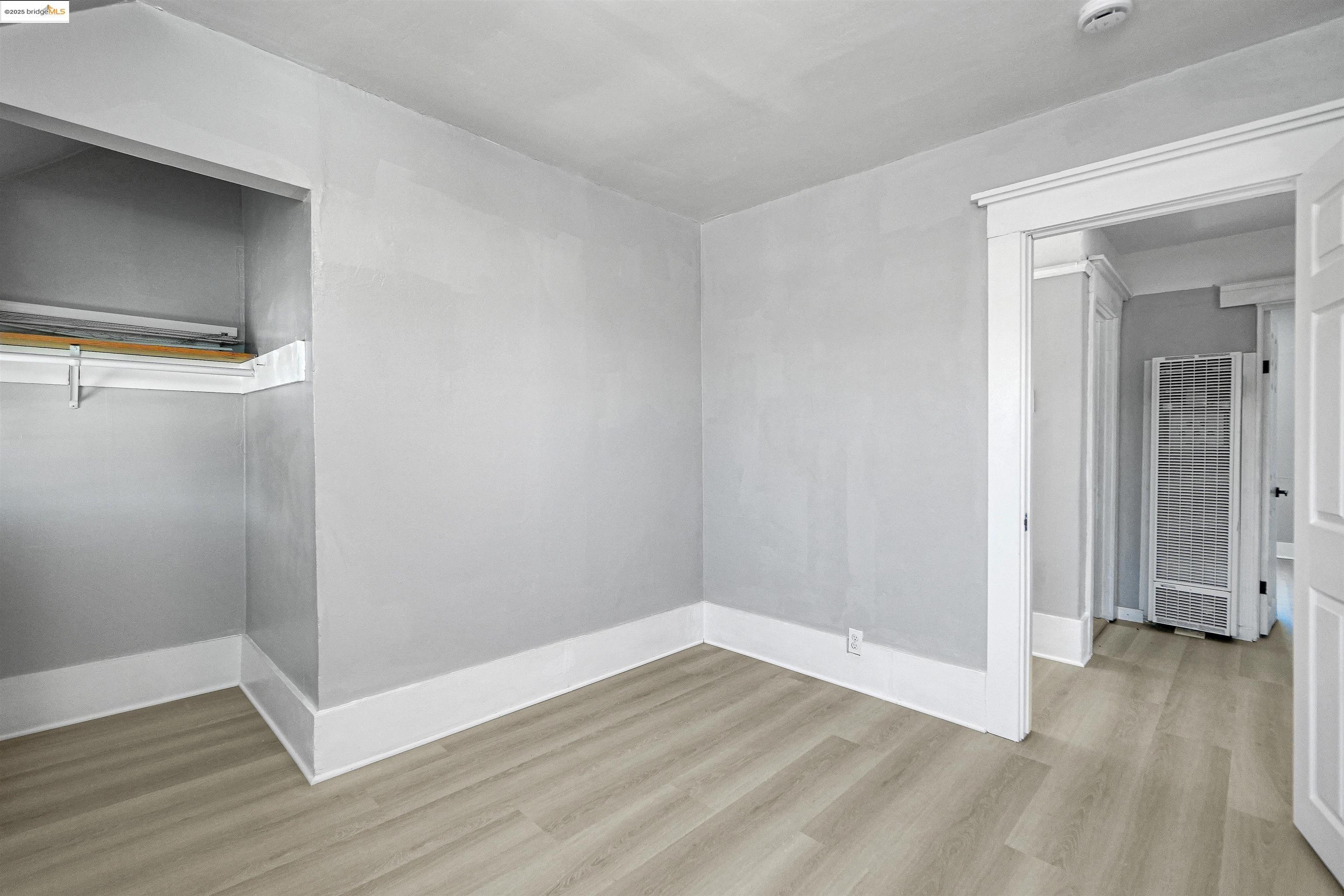 2207 East 19th Street Oakland, CA 94606 - Photo 17 of 30 a view of a room with wooden floor