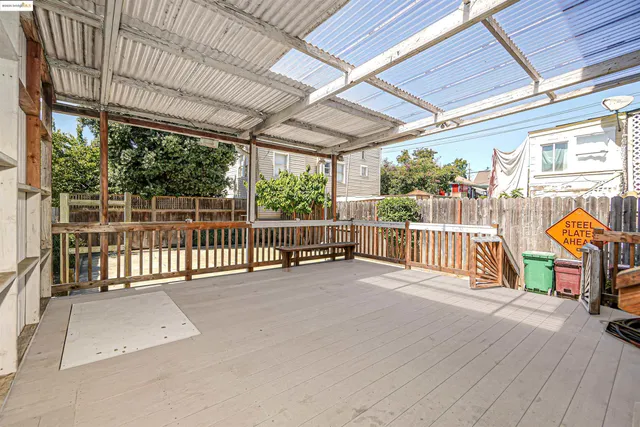 a view of a porch with wooden floor