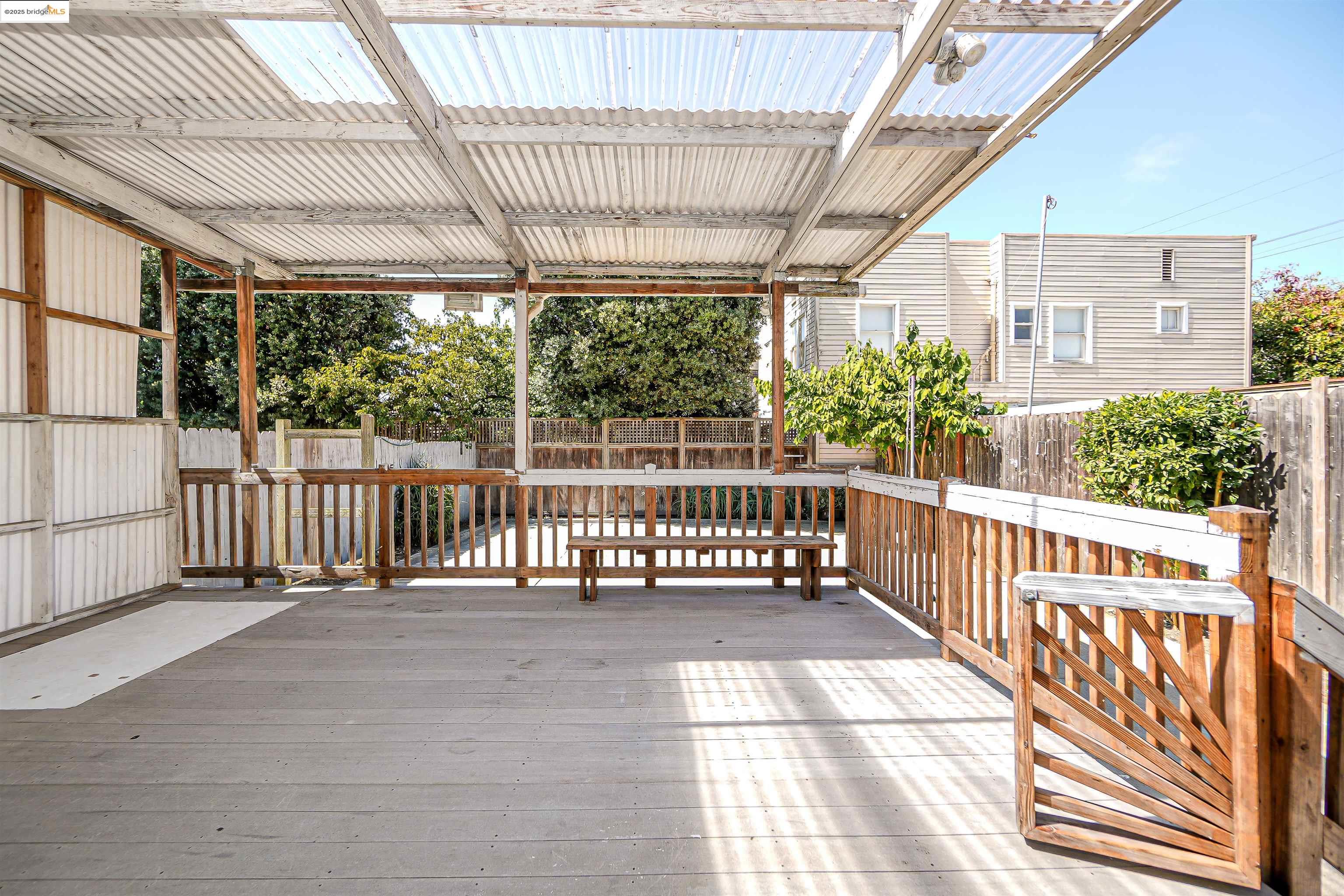 2207 East 19th Street Oakland, CA 94606 - Photo 26 of 30 a view of a porch with wooden floor