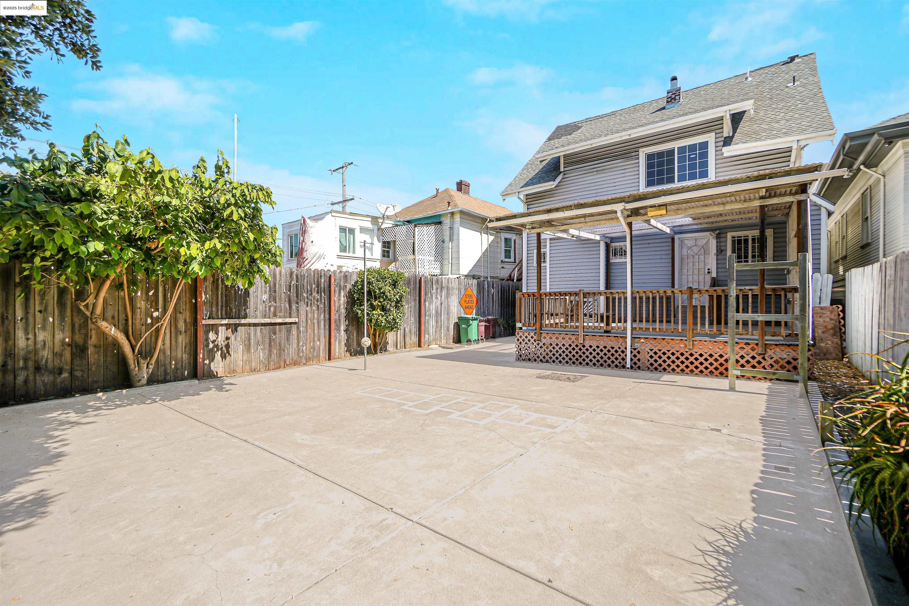 2207 East 19th Street Oakland, CA 94606 - Photo 28 of 30 a front view of a house with a yard