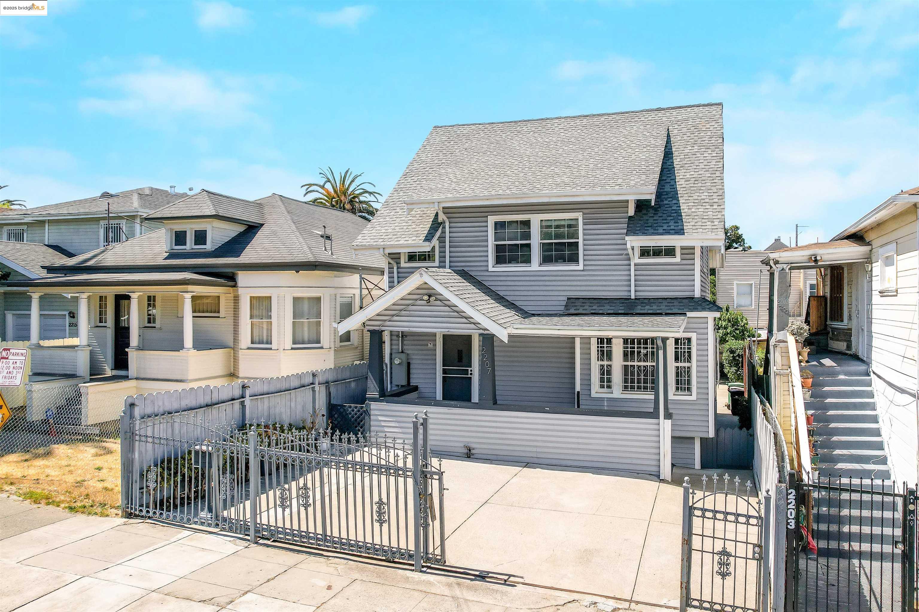 2207 East 19th Street Oakland, CA 94606 - Photo 29 of 30 a front view of a house with a porch