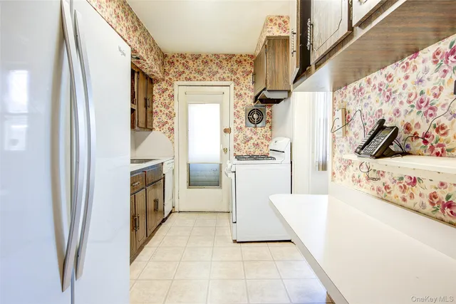 a view of living room with furniture and a fireplace