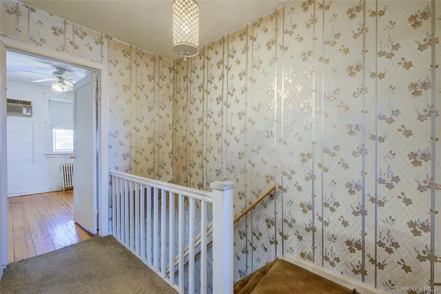a bathroom with a granite countertop shower and a sink