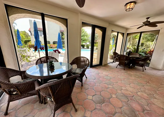 a swimming pool view with a garden