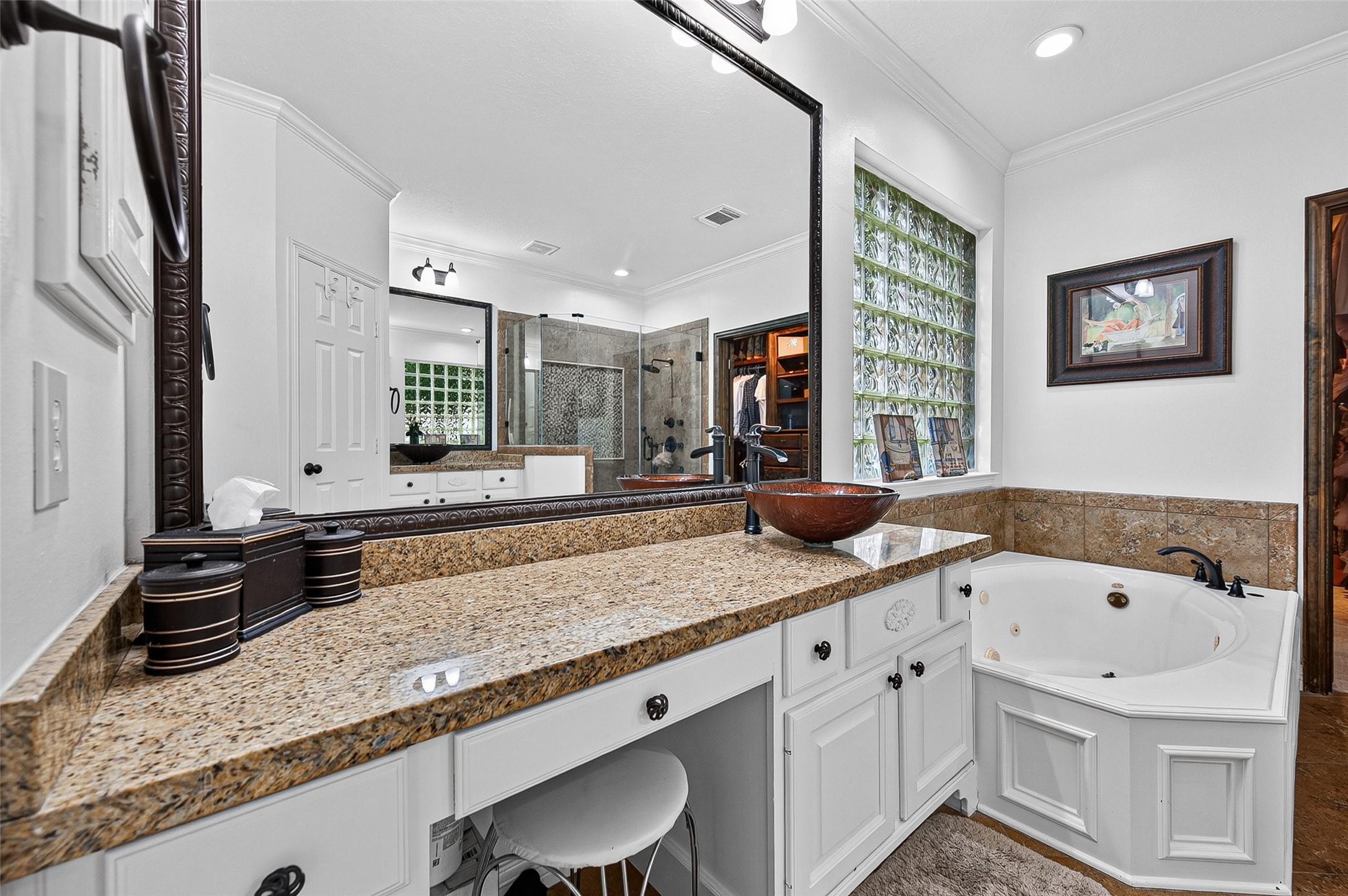 11822 Rue Beaujon Court Tomball, TX 77377 - Photo 26 of 50 The left side vanity offers enough room for makeup and hair products.
