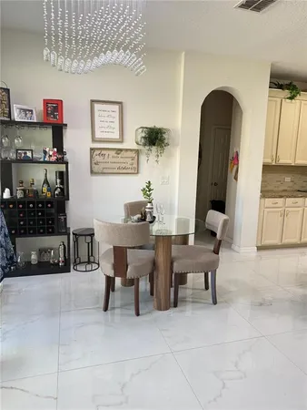 a living room with furniture a rug and a table