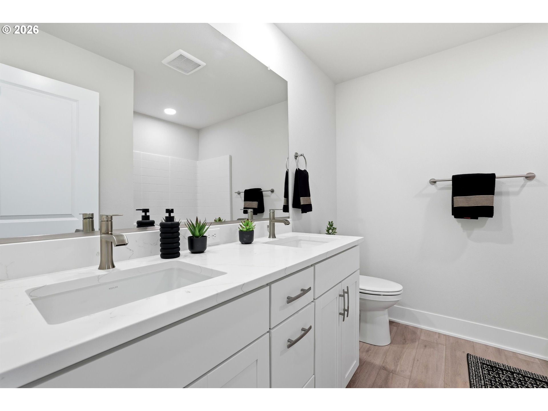 6749 Southwest Windflower Street Wilsonville, OR 97070 - Photo 29 of 33 a bathroom with a sink a toilet and mirror