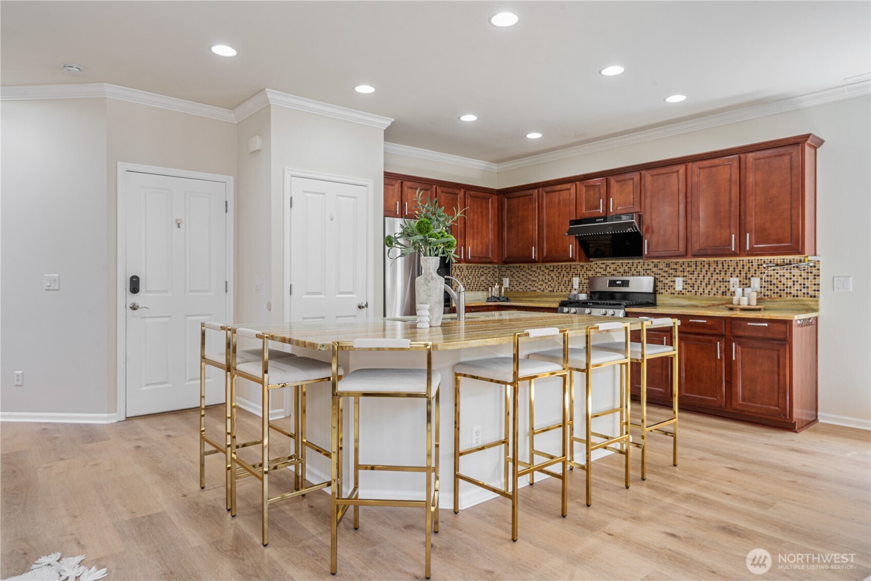 9528 25th Drive Southeast Everett, WA 98208 - Photo 17 of 36 a kitchen with kitchen island granite countertop wooden cabinets and stainless steel appliances