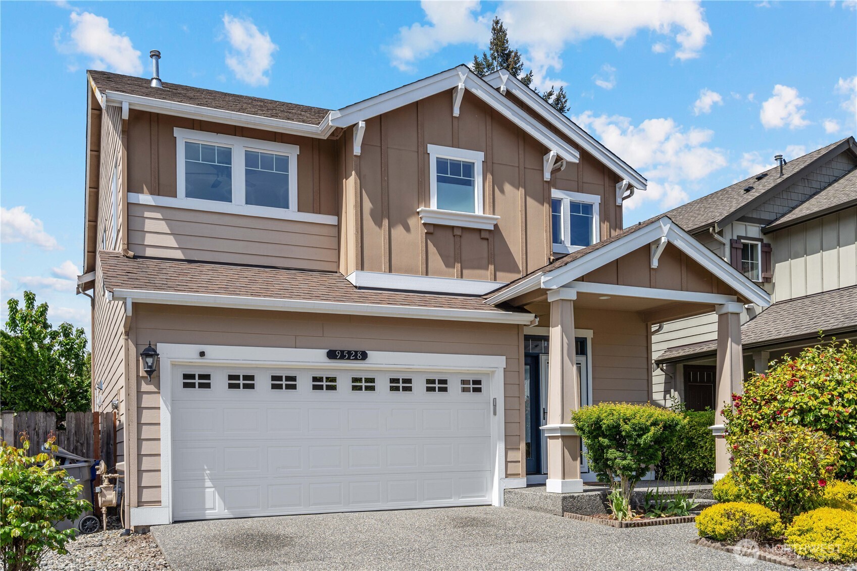 9528 25th Drive Southeast Everett, WA 98208 - Photo 2 of 36 a front view of a house with a yard and potted plants