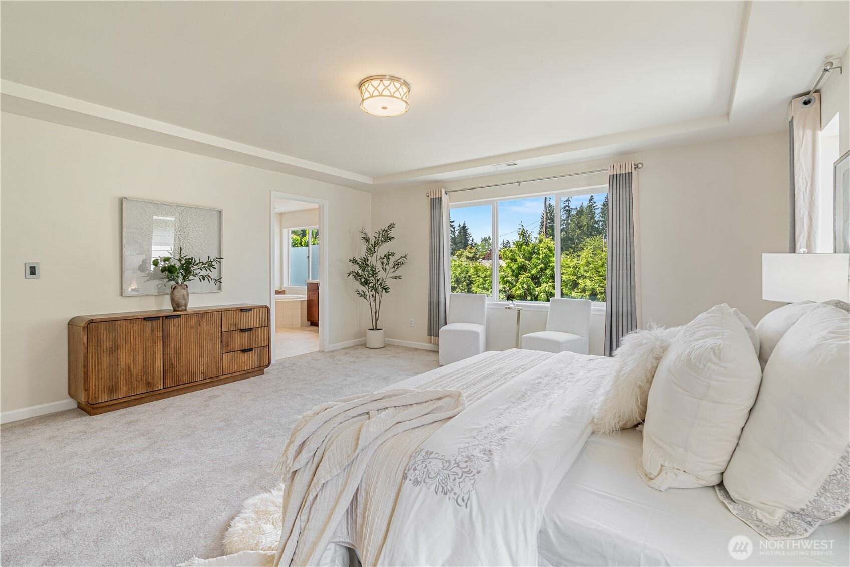 9528 25th Drive Southeast Everett, WA 98208 - Photo 22 of 36 a bedroom with a large bed and a large window