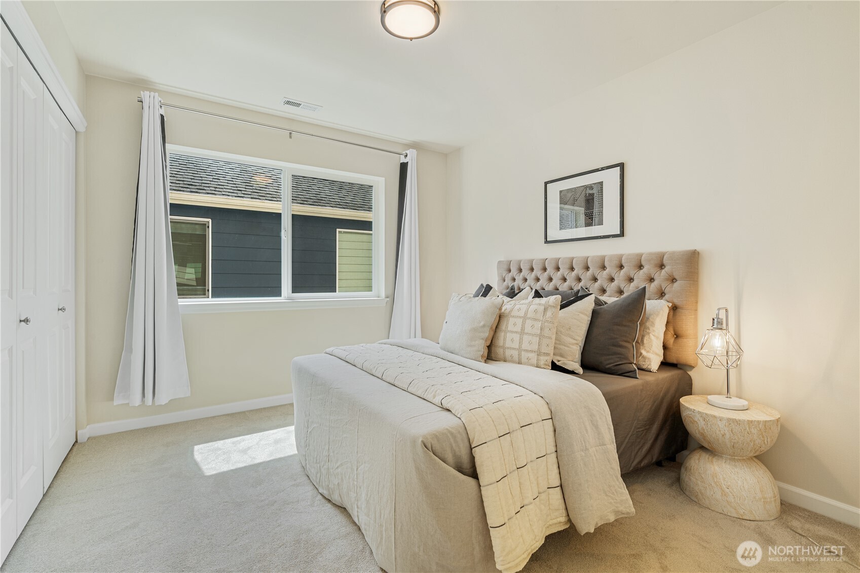 9528 25th Drive Southeast Everett, WA 98208 - Photo 28 of 36 a bedroom with bed and a window