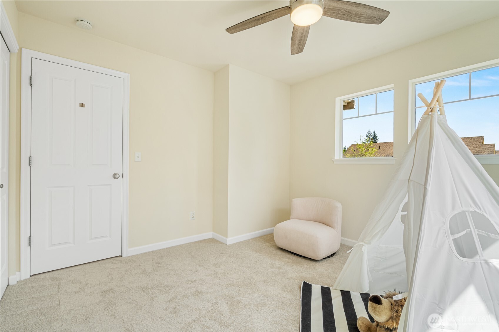 9528 25th Drive Southeast Everett, WA 98208 - Photo 31 of 36 a bedroom with a bed and a chair