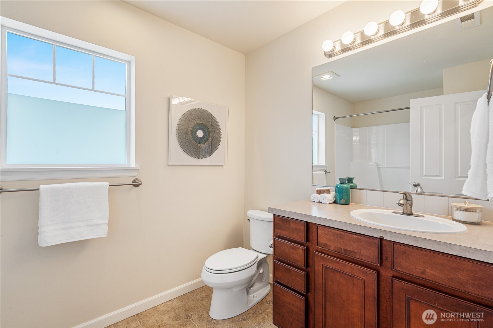 9528 25th Drive Southeast Everett, WA 98208 - Photo 32 of 36 a bathroom with a toilet a sink and mirror