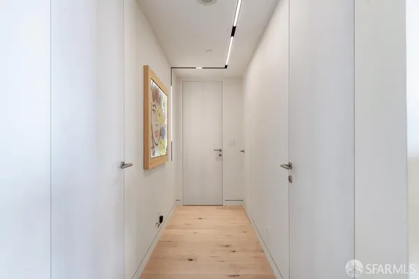 a bathroom with a shower and a glass door