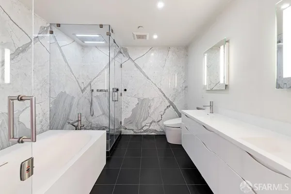 a bathroom with a bathtub and a sink