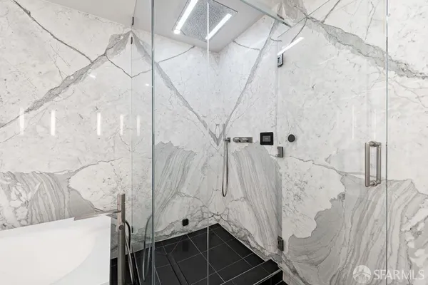 a bedroom with a bed and a white door