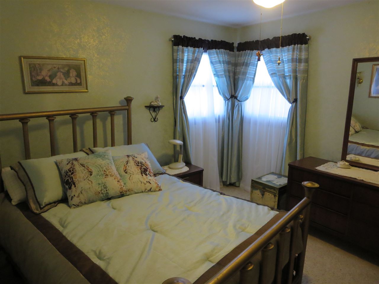 5825 Tipple Road Rockford, IL 61102 - Photo 3 of 25 a bed sitting in a bedroom next to a window