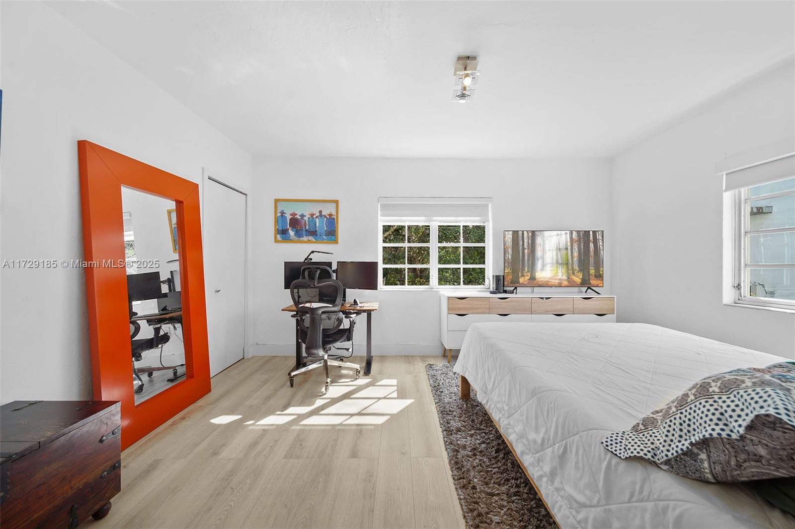 832 15th Street, Unit 4 Miami Beach, FL 33139 - Photo 11 of 17 a spacious bedroom with a bed and a large window