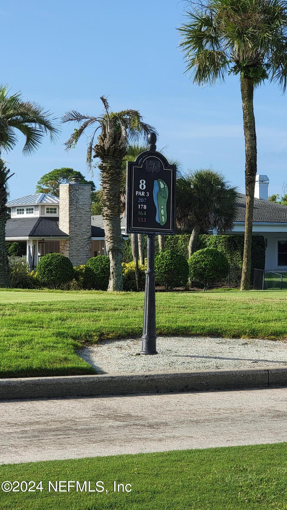 324 Pablo Road Ponte Vedra Beach, FL 32082 - Photo 2 of 11 a front view of a house with a yard and garage