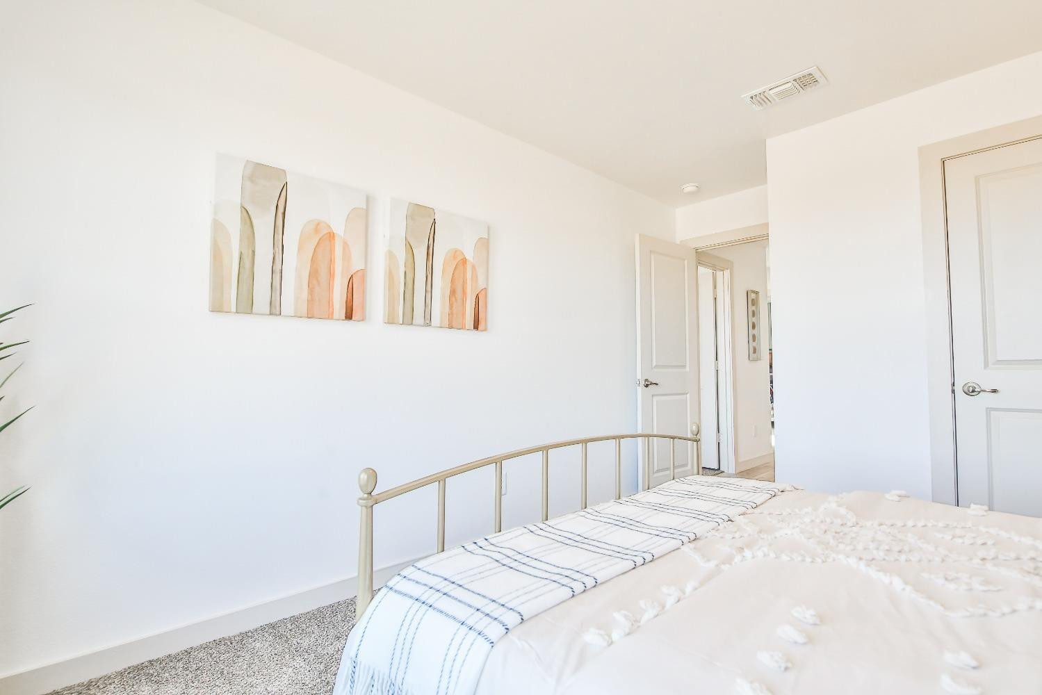 6802 55th Street Lubbock, TX 79407 - Photo 12 of 36 a bedroom with a bed and wall painting