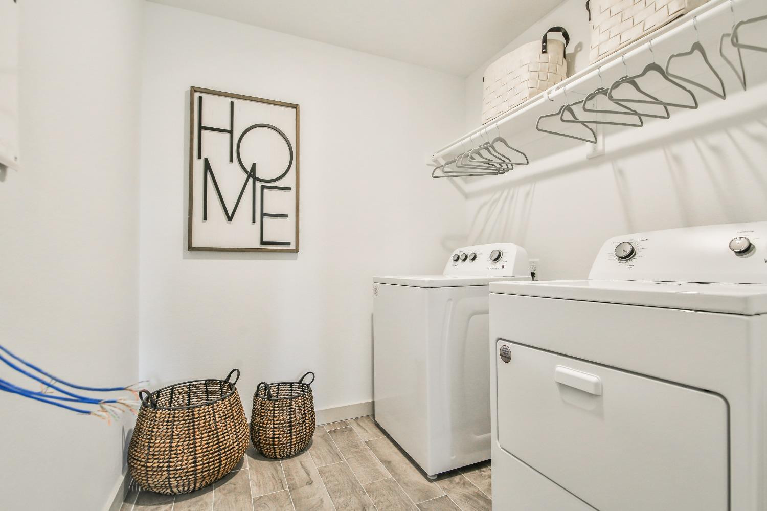 6802 55th Street Lubbock, TX 79407 - Photo 18 of 36 a utility room with dryer and washer