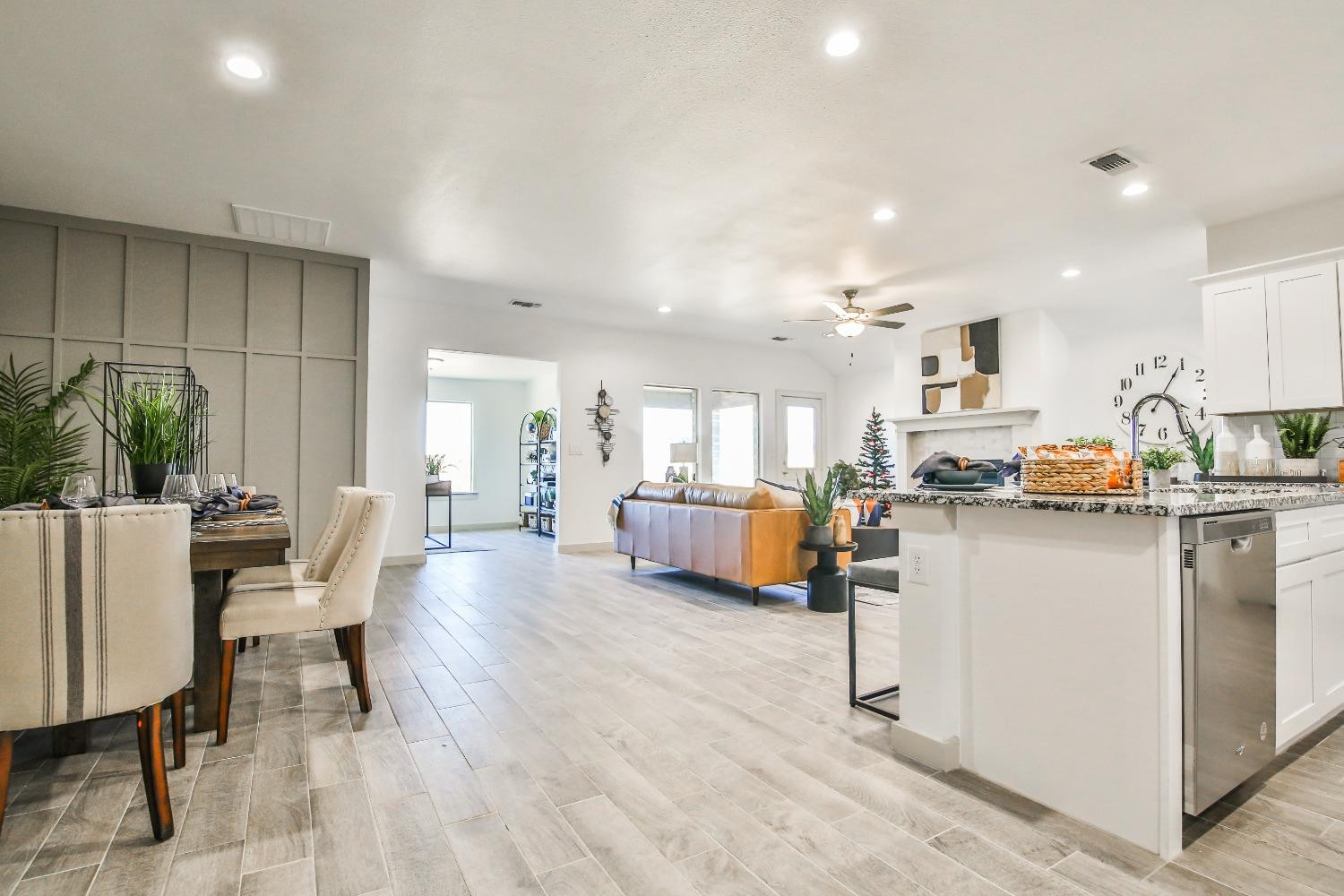 6802 55th Street Lubbock, TX 79407 - Photo 22 of 36 a living room with stainless steel appliances kitchen island granite countertop furniture and a kitchen view