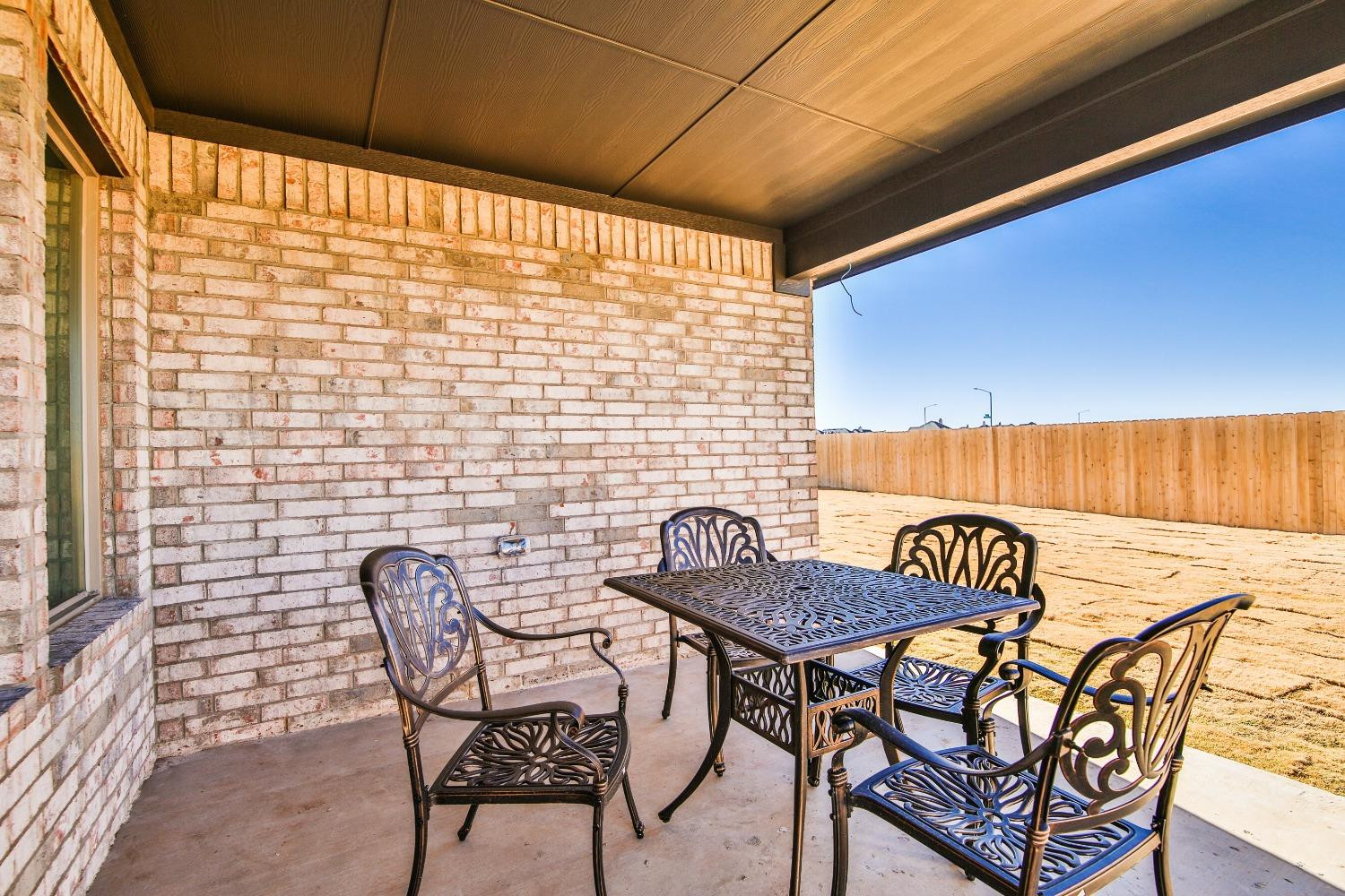 6802 55th Street Lubbock, TX 79407 - Photo 34 of 36 a view of a chairs and table in the patio