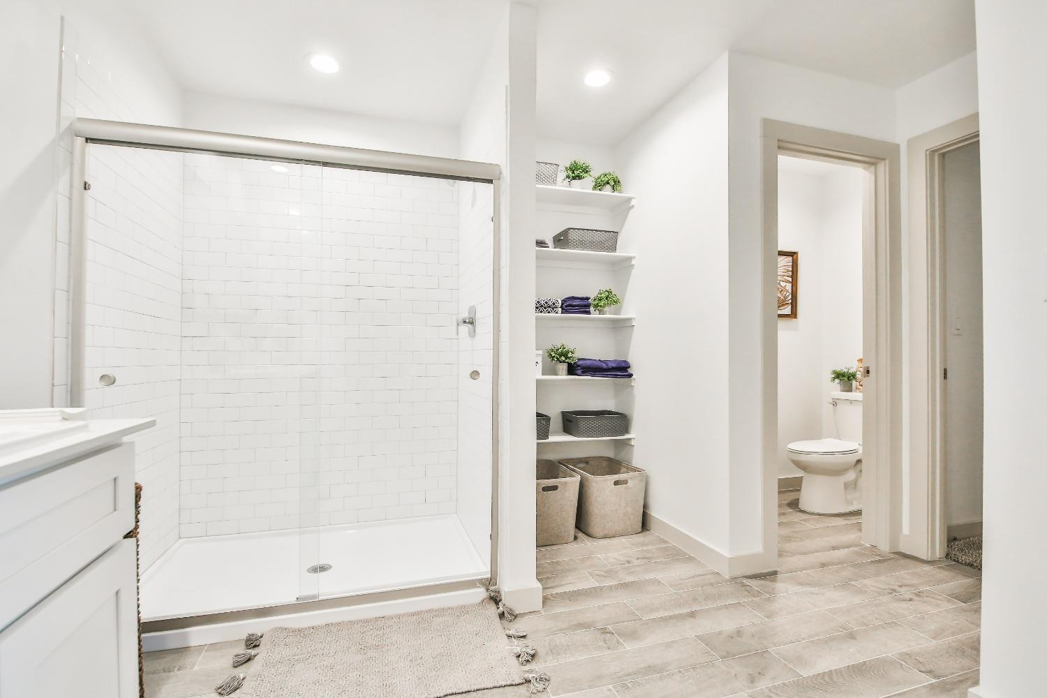 6802 55th Street Lubbock, TX 79407 - Photo 8 of 36 a bathroom with a shower and a toilet