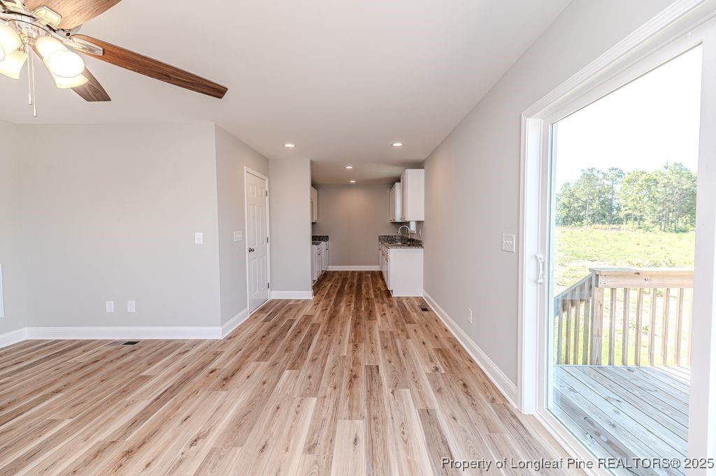 932 Allstar Avenue Cameron, NC 28326 - Photo 11 of 33 a view of hallway with a large window and wooden floor