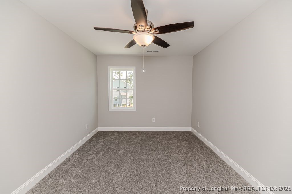 932 Allstar Avenue Cameron, NC 28326 - Photo 21 of 33 an empty room with a window and a fan