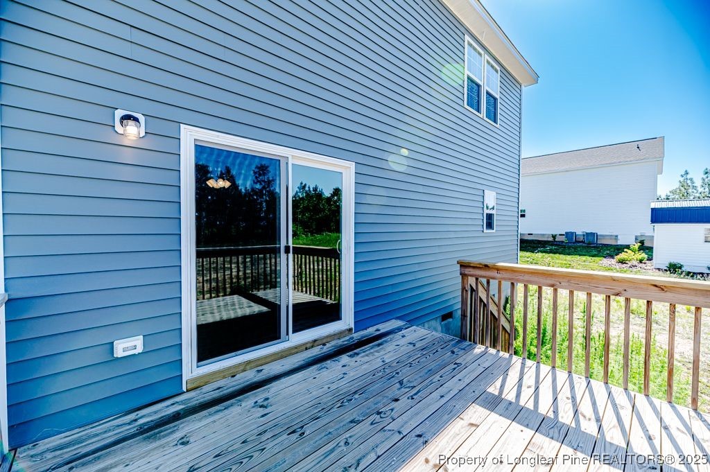 932 Allstar Avenue Cameron, NC 28326 - Photo 31 of 33 a view of a house with wooden deck