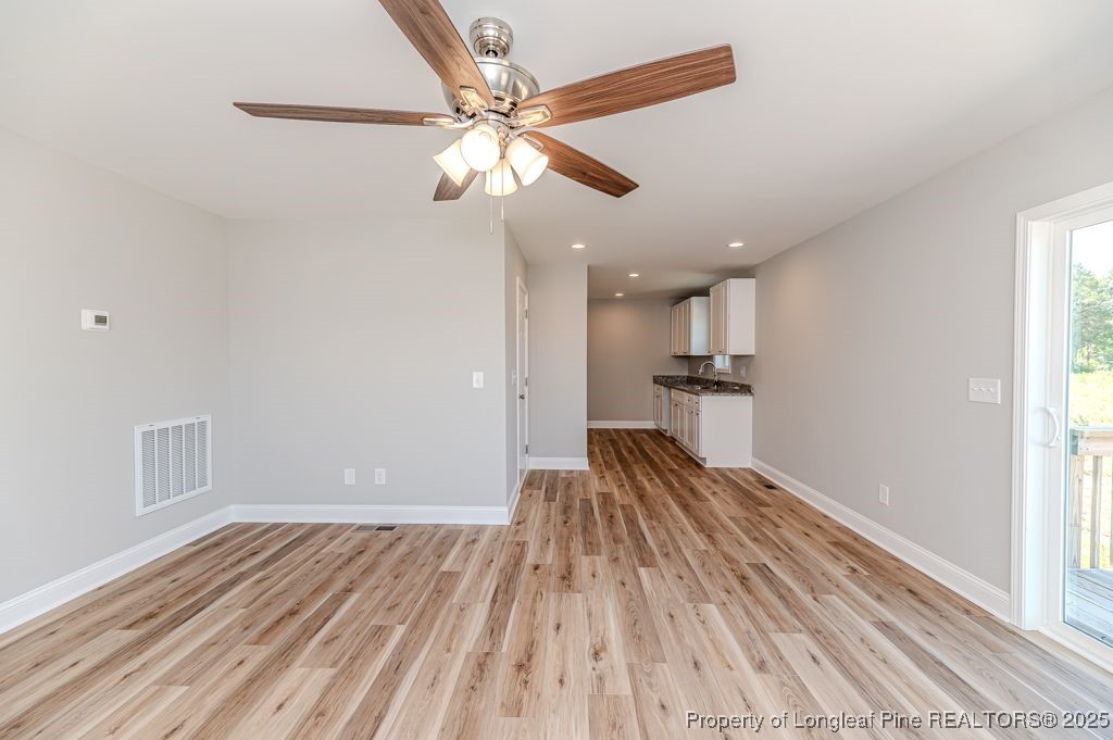 932 Allstar Avenue Cameron, NC 28326 - Photo 9 of 33 a view of a livingroom with wooden floor
