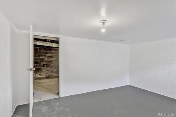 an empty room with cabinet door