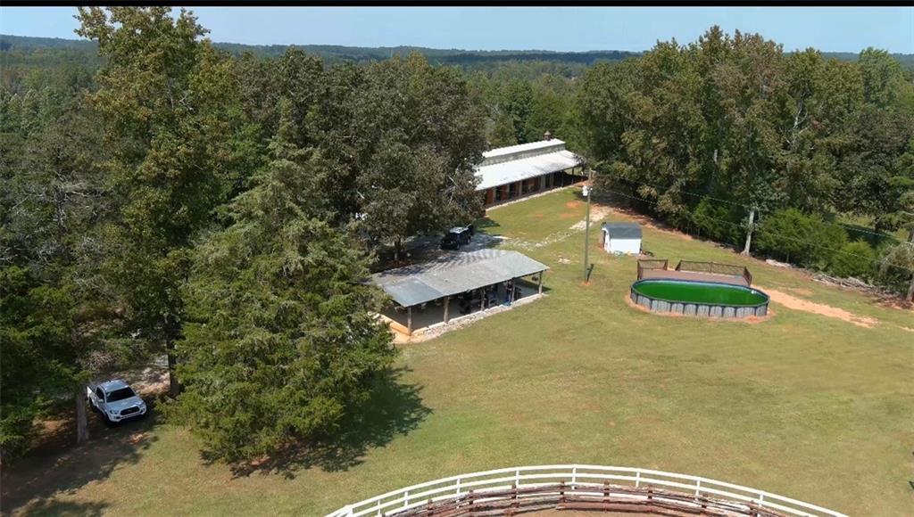 2011 Stinchcomb Road Dewy Rose, GA 30634 - Photo 16 of 20 a view of a swimming pool with a yard