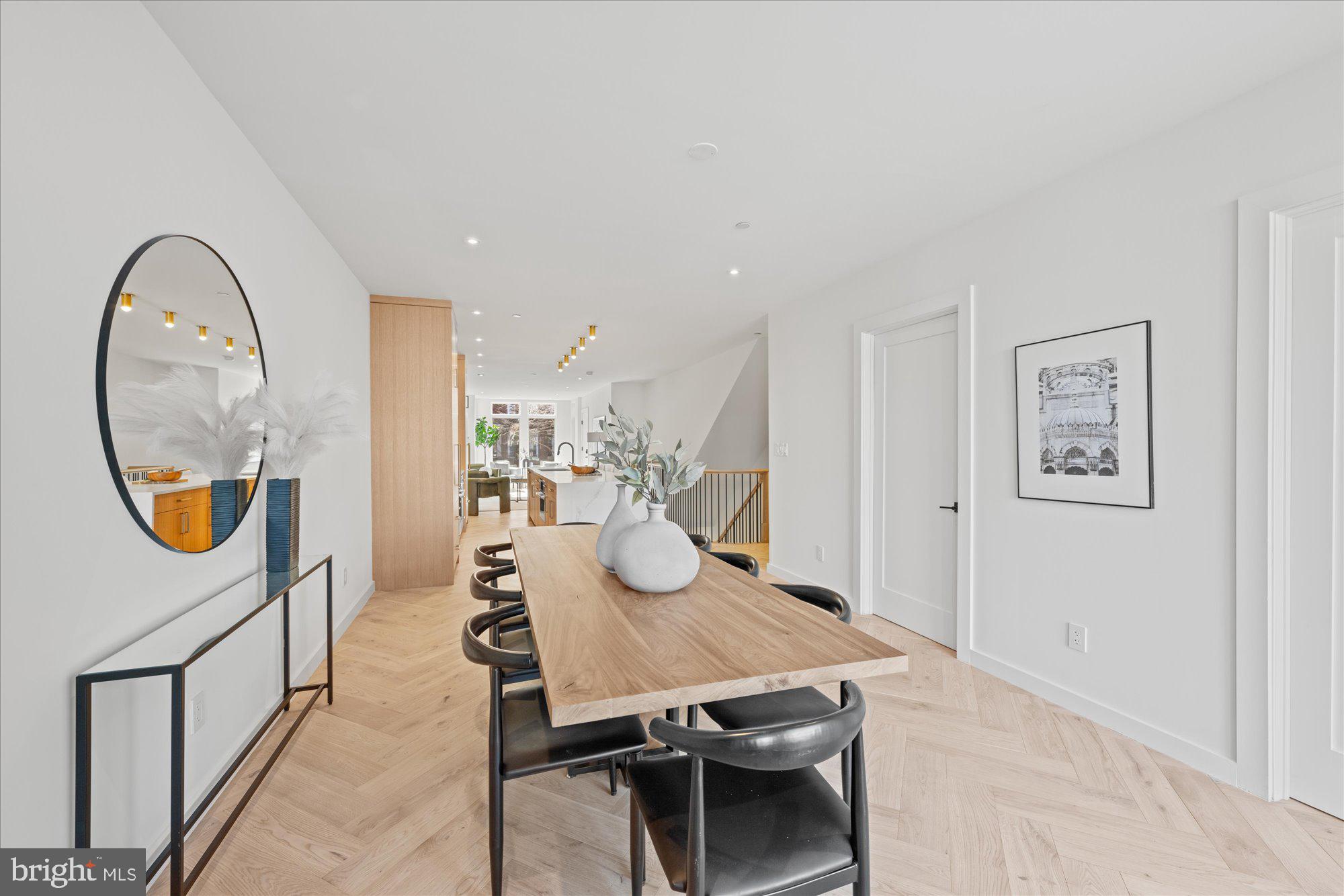 1319 R Street Northwest, Unit 2100 Washington, DC 20009 - Photo 13 of 36 a dining room with furniture and a mirror