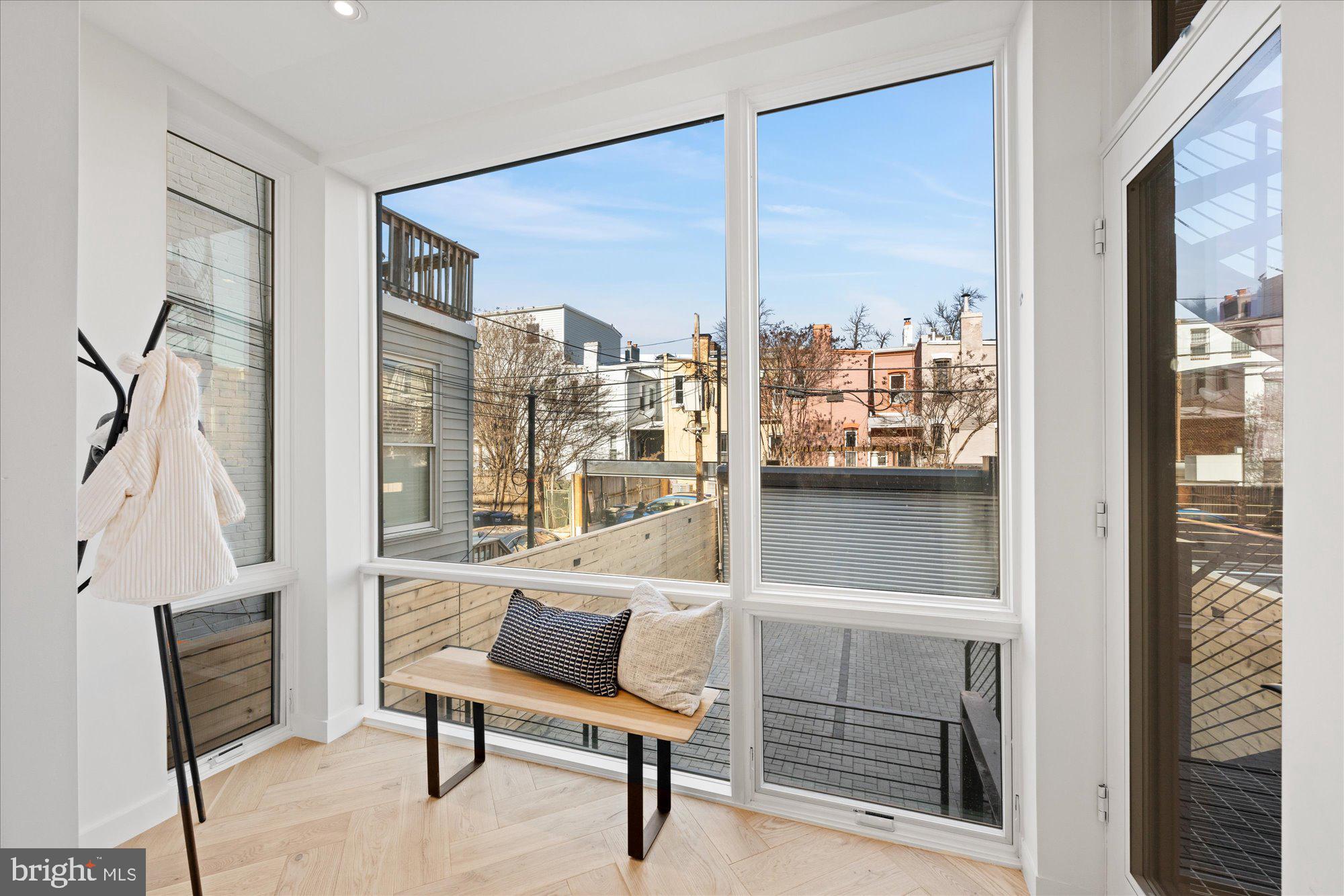 1319 R Street Northwest, Unit 2100 Washington, DC 20009 - Photo 15 of 36 a room with a window and a chair